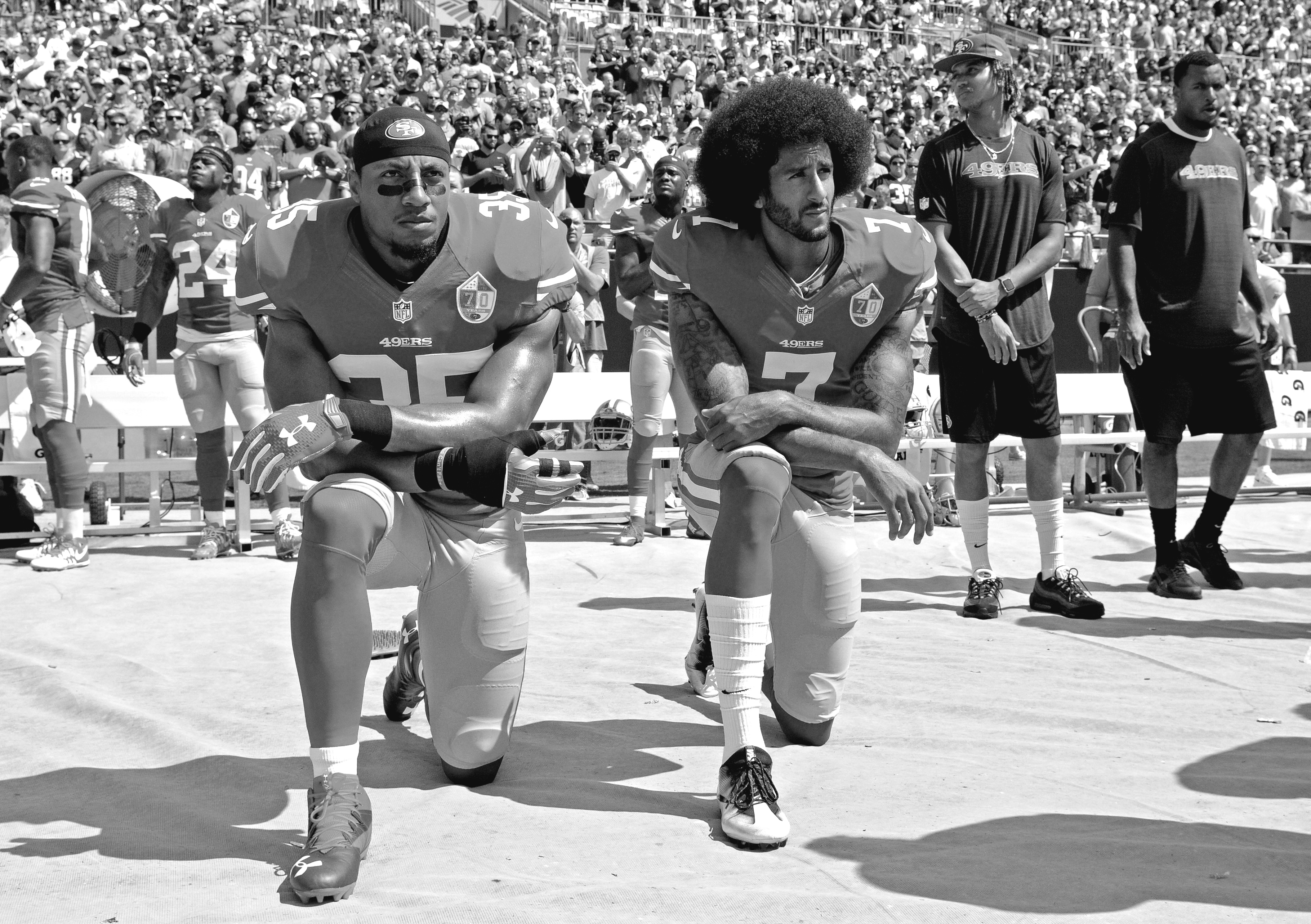 San Francisco 49ers' Colin Kaepernick (7) and Eric Reid (35) kneel during the national anthem before an NFL football game against the Carolina Panthers in Charlotte, on Sunday, Sept. 18.(AP Photo/Mike McCarn)