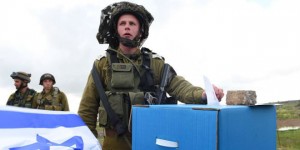 An IDF soldier casts his ballot during the recent election.