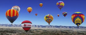 Hot air balloons in flight over Colorado.